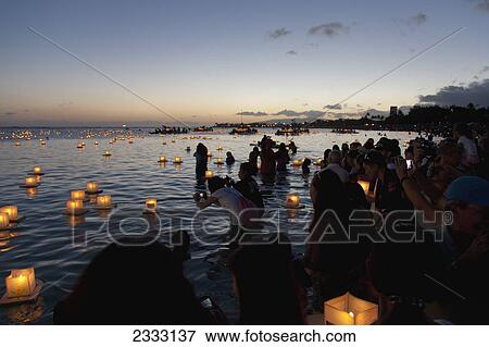 Stock Photo - Annual lantern floating ceremony during sunset at Ala Moana; Oahu, Hawaii, United States of America. Fotosearch