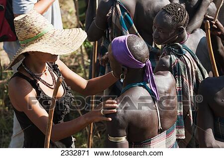 Anthropologist And Mursi Warrior Tribe; Dirikoro, Ethiopia View Large Photo Image Stock Image - Anthropologist And Mursi Warrior Tribe; Dirikoro, Ethiopia. Fotosearch