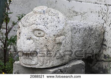Stock Image - Anthropomorphic Stone Head On Display In The Site Museum Of Chavin De Huantar, Ancash, Peru. Fotosearch
