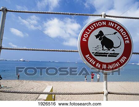 Stock Photograph - Anti Dog Turd Sign On The Beach. Fotosearch