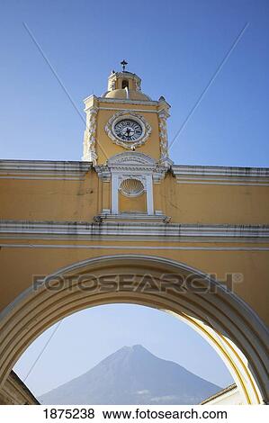 Antigua, Guatemala; A Clock In An Archway With A View Of A Mountain Through The Arch View Large Photo Image Stock Photo - Antigua, Guatemala; A Clock In An Archway With A View Of A Mountain Through The Arch. Fotosearch