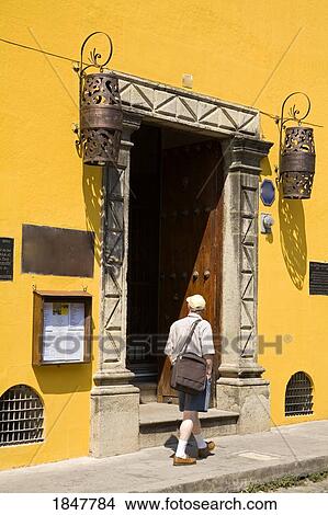 Antigua, Guatemala, Central America; Man Walking By Colonial Style Restaurant View Large Photo Image Picture - Antigua, Guatemala, Central America; Man Walking By Colonial Style Restaurant. Fotosearch