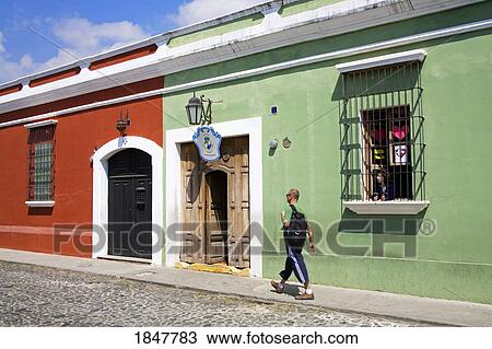 Antigua, Guatemala, Central America; Man Walking By Colonial Style School View Large Photo Image Stock Image - Antigua, Guatemala, Central America; Man Walking By Colonial Style School. Fotosearch