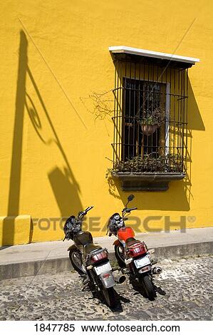 Stock Photography - Antigua, Guatemala, Central America; Motorcycles Parked Outside Restaurant. Fotosearch