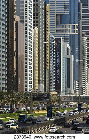 Stock Image - Apartment and office buildings lining Sheikh Zayed Road; Dubai, United Arab Emirates. Fotosearch