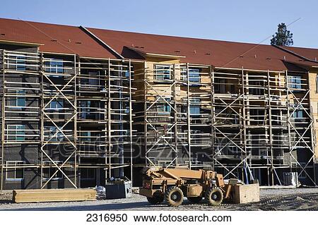 Apartment Building Under Construction; Kelowna British Columbia Canada View Large Photo Image Stock Image - Apartment Building Under Construction; Kelowna British Columbia Canada. Fotosearch