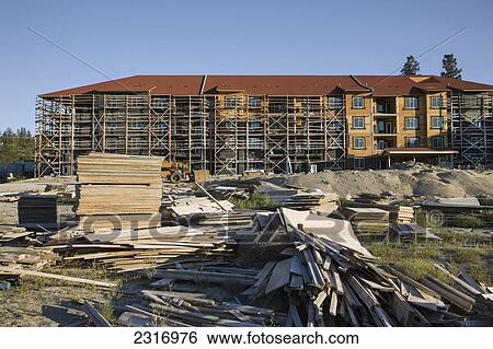 Stock Photograph - Apartment Building Under Construction; Kelowna British Columbia Canada. Fotosearch