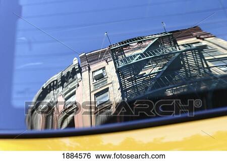 Apartment Building With Fire Escapes Reflected In Taxi Window View Large Photo Image Stock Photograph - Apartment Building With Fire Escapes Reflected In Taxi Window. Fotosearch