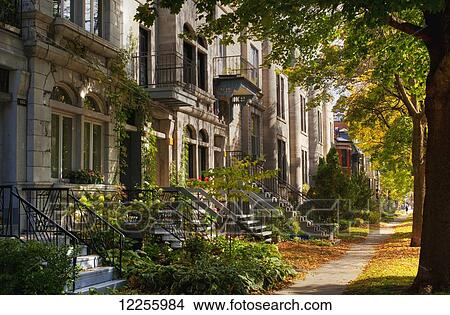 Apartment buildings along city street; Montreal, Quebec, Canada View Large Photo Image Picture - Apartment buildings along city street; Montreal, Quebec, Canada. Fotosearch