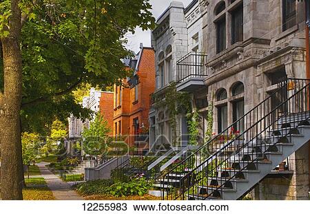 Apartment buildings along city street; Montreal, Quebec, Canada View Large Photo Image Stock Image - Apartment buildings along city street; Montreal, Quebec, Canada. Fotosearch