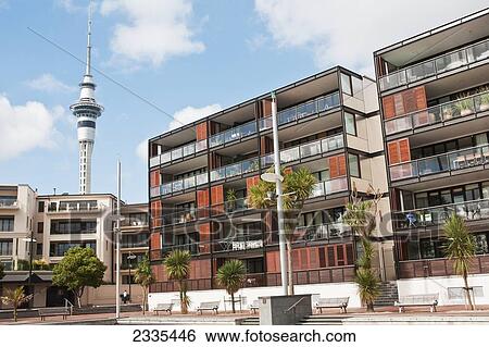 Stock Photograph - Apartments With Tower In Background; New Zealand. Fotosearch