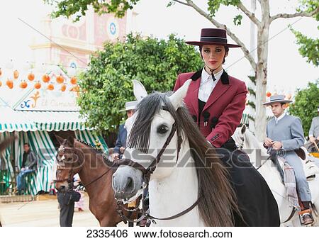 April Feria Festival, Horse Riders In Traditional Dress; Seville, Andalucia, Spain View Large Photo Image Stock Photograph - April Feria Festival, Horse Riders In Traditional Dress; Seville, Andalucia, Spain. Fotosearch