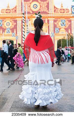 Stock Photo - April Feria Festival, Woman In Traditional Dress; Seville, Andalucia, Spain. Fotosearch