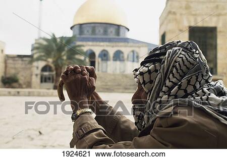 Stock Image - Arab At The Dome Of The Rock. Fotosearch