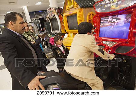 Stock Image - Arcade Games Inside The Family Mall Shopping Mall At Erbil, Iraqi Kurdistan, Iraq. Fotosearch