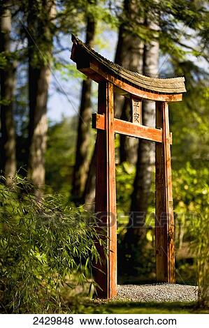 Stock Photo - Arch on pathway in the Japanese Gardens; Mayne Island, British Columbia, Canada. Fotosearch