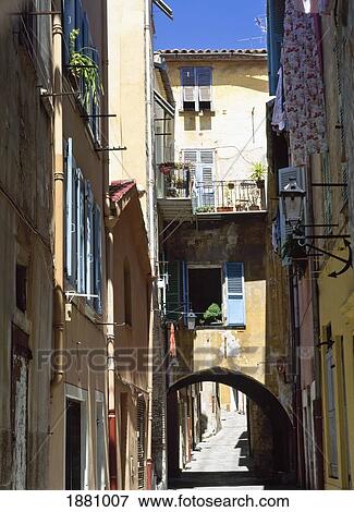 Stock Photo - Arch Over Narrow Street, Elevated View. Fotosearch