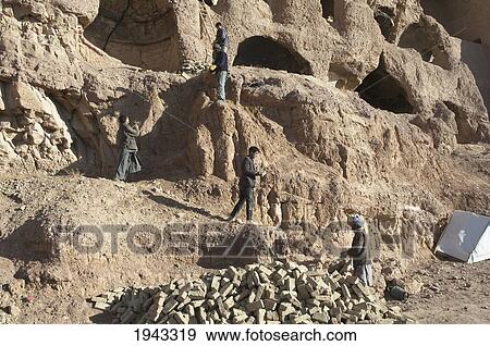 Stock Photo - Archaeological Teams Working On The Restoration Of The Cliffs At Bamiyan, Bamian Province, Afghanistan. Fotosearch