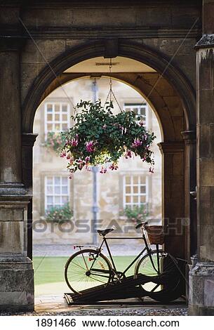 Stock Photograph - Arched Entrance With Parked Bicycle. Fotosearch