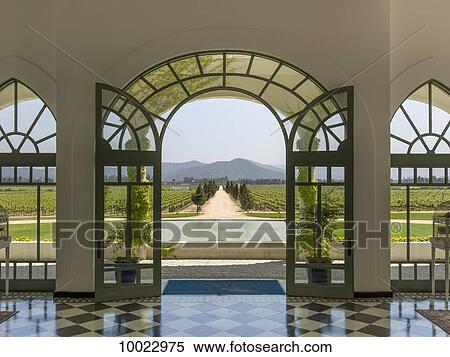 Stock Photography - Arched glass doors leading out to a vineyard, Casablanca Valley; Casablanca, Valparaiso, Chile. Fotosearch