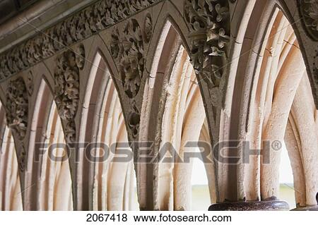 Stock Photo - Arches Between The Double Columns Of The Cloister Of The Abbey Of Mont-Saint-Michel, France. Fotosearch