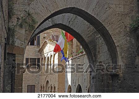 Arches In Stonework And Flags On The Edge Of A Building; San Gimignano Italy View Large Photo Image Picture - Arches In Stonework And Flags On The Edge Of A Building; San Gimignano Italy. Fotosearch