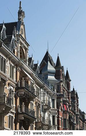Stock Image - Architectural Detail In The Rooflines Against A Blue Sky With Crosses On The Peaks; Zurich Switzerland. Fotosearch