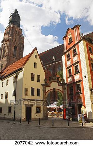 Stock Image - Archway Between Two Houses To St. Elizabeth's Church Off Rynek Square; Wroclaw Poland. Fotosearch