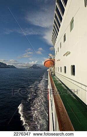 Stock Photo - Arctic Circle as seen from onboard the Hurtigrunta cruise ship MS Nordlys in wintertime; Norway. Fotosearch