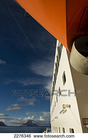 Stock Photograph - Arctic Circle as seen from onboard the Hurtigrunta cruise ship MS Nordlys in wintertime; Norway. Fotosearch