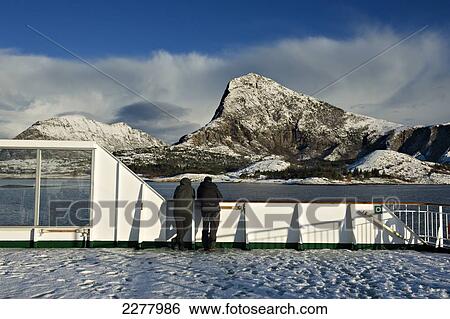 Stock Photograph - Arctic Circle as seen from onboard the Hurtigrunta cruise ship MS Nordlys in wintertime; Norway. Fotosearch