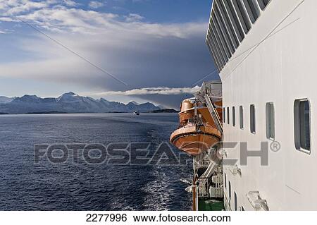 Stock Photograph - Arctic Circle as seen from onboard the Hurtigrunta cruise ship MS Nordlys in wintertime; Norway. Fotosearch