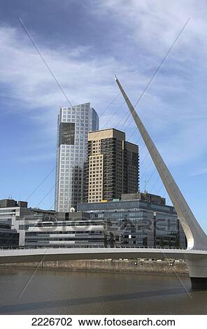 Argentina, redevelopment of old dock area; Buenos Aires, Modern bridge and buildings in Puerto Madero district View Large Photo Image Stock Image - Argentina, redevelopment of old dock area; Buenos Aires, Modern bridge and buildings in Puerto Madero district. Fotosearch
