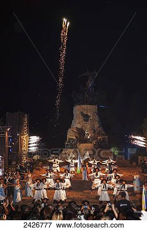 Stock Photo - Argentine folklore dance in front of monument; Mendoza, Argentina. Fotosearch