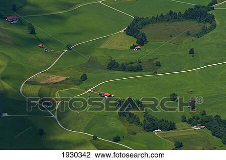 Arial view of lush green fields and houses; Bavaria, Germany View Large Photo Image Stock Image - Arial view of lush green fields and houses; Bavaria, Germany. Fotosearch