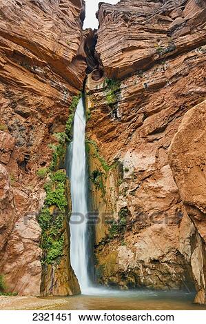 Stock Image - Arizona, Grand Canyon National Park, Upper Deer Creek Falls Framed By Red Rock.. Fotosearch