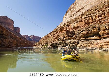 Stock Image - Arizona, Grand Canyon National Park, Friends Rafting On The Colorado River, Calm Water. Editorial Use Only.. Fotosearch