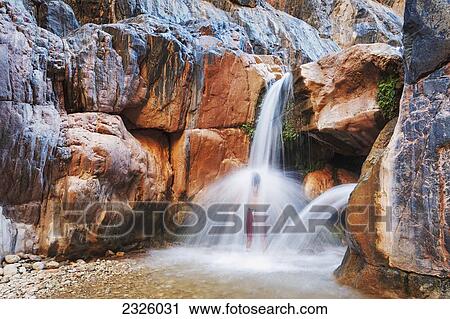 Arizona, Grand Canyon National Park, Clear Creek Falls, Man Under Waterfall. View Large Photo Image Stock Image - Arizona, Grand Canyon National Park, Clear Creek Falls, Man Under Waterfall.. Fotosearch