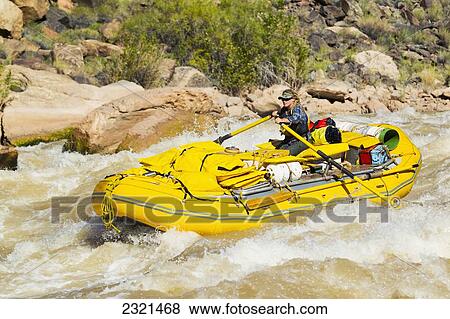 Stock Photo - Arizona, Grand Canyon National Park, Woman Rafting On The Colorado River. Editorial Use Only.. Fotosearch