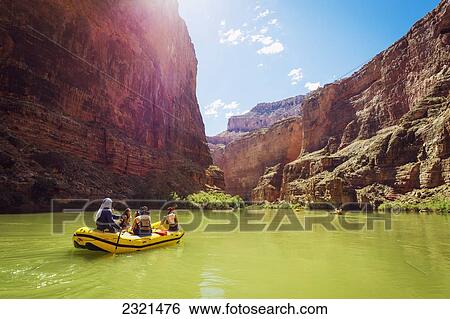 Stock Photograph - Arizona, Grand Canyon National Park, Friends Rafting On The Colorado River, Calm Water. Editorial Use Only.. Fotosearch