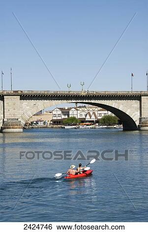 Arizona, Lake Havasu City, The London Bridge, a reconstruction of the one in England, Couple kayaks torwards bridge. View Large Photo Image Stock Photograph - Arizona, Lake Havasu City, The London Bridge, a reconstruction of the one in England, Couple kayaks torwards bridge.. Fotosearch