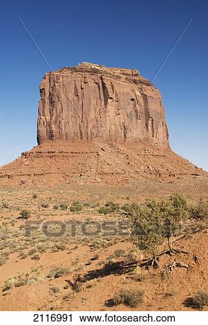 Stock Image - Arizona, Navajo Tribal Park, Monument Valley, View of the Merrick Butte in the desert.. Fotosearch