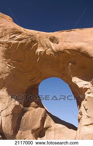 Arizona, Navajo Tribal Park, Monument Valley, Mystery Valley, The Ear of the Wind Arch. View Large Photo Image Stock Image - Arizona, Navajo Tribal Park, Monument Valley, Mystery Valley, The Ear of the Wind Arch.. Fotosearch