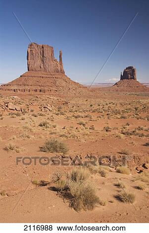 Stock Photo - Arizona, Navajo Tribal Park, Monument Valley, View of the East and West Mitten Buttes in the desert.. Fotosearch