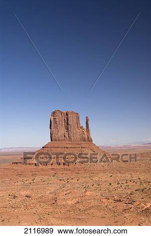 Arizona, Navajo Tribal Park, Monument Valley, View of the West Mitten Butte in the desert. View Large Photo Image Stock Photo - Arizona, Navajo Tribal Park, Monument Valley, View of the West Mitten Butte in the desert.. Fotosearch