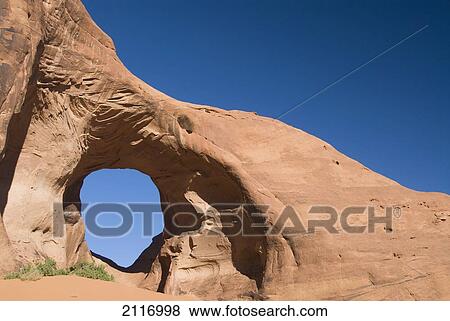 Arizona, Navajo Tribal Park, Monument Valley, Mystery Valley, The Ear of the Wind Arch. View Large Photo Image Stock Photo - Arizona, Navajo Tribal Park, Monument Valley, Mystery Valley, The Ear of the Wind Arch.. Fotosearch