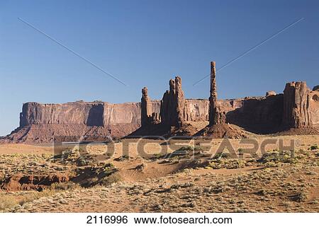 Stock Photograph - Arizona, Navajo Tribal Park, Monument Valley, View of the Totem Pole and Yei Bi Chei.. Fotosearch