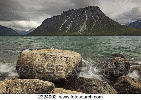 Stock Image - Ark Mountain with Kusawa Lake; Yukon, Canada. Fotosearch