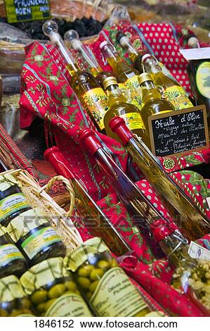 Stock Image - Arles, Provence, France; Market Stall With Olives And Olive Oil. Fotosearch