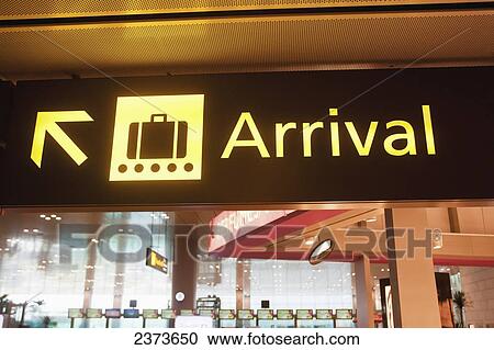 Stock Image - Arrival sign in an airport terminal; Singapore. Fotosearch